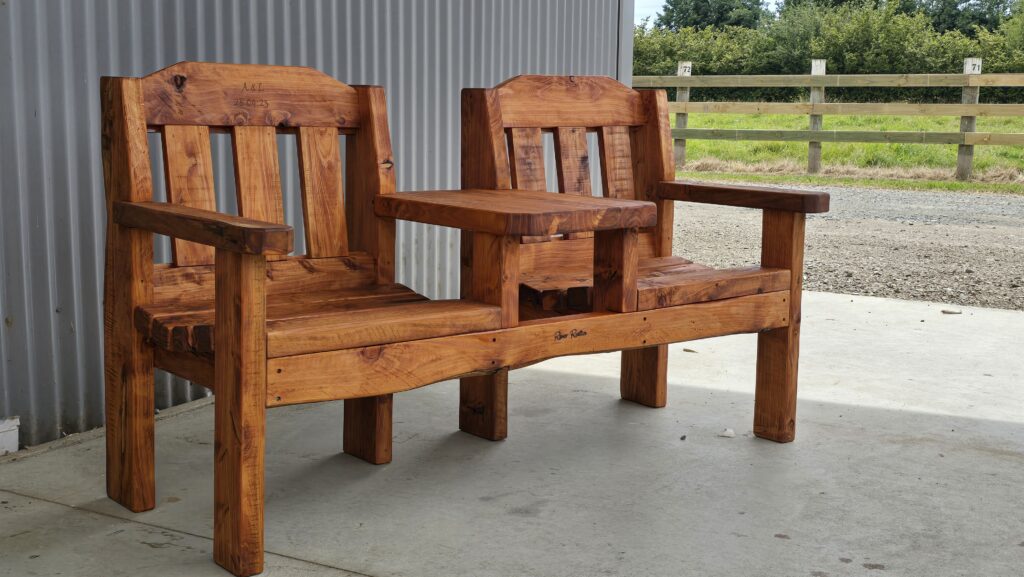 Jack and Jill seat installed outdoors, macrocarpa timber garden furniture